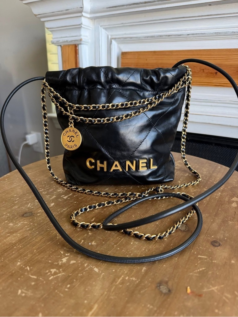 CHANEL Black Quilted Leather Mini Drawstring Bag with Gold Hardware